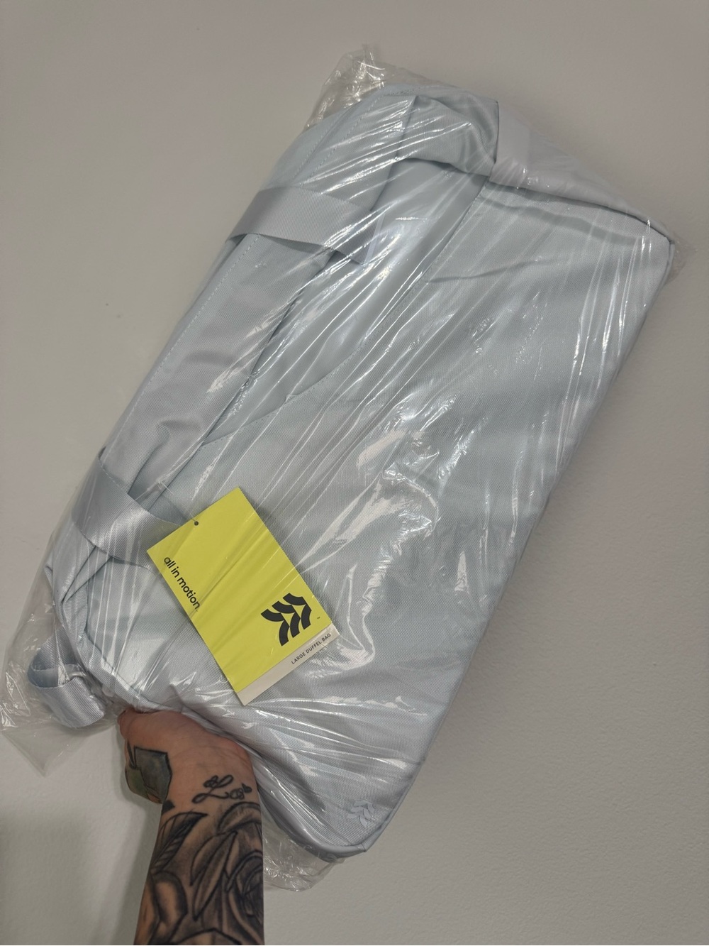 all in motion Pale Blue Travel Duffel with Yellow Tag